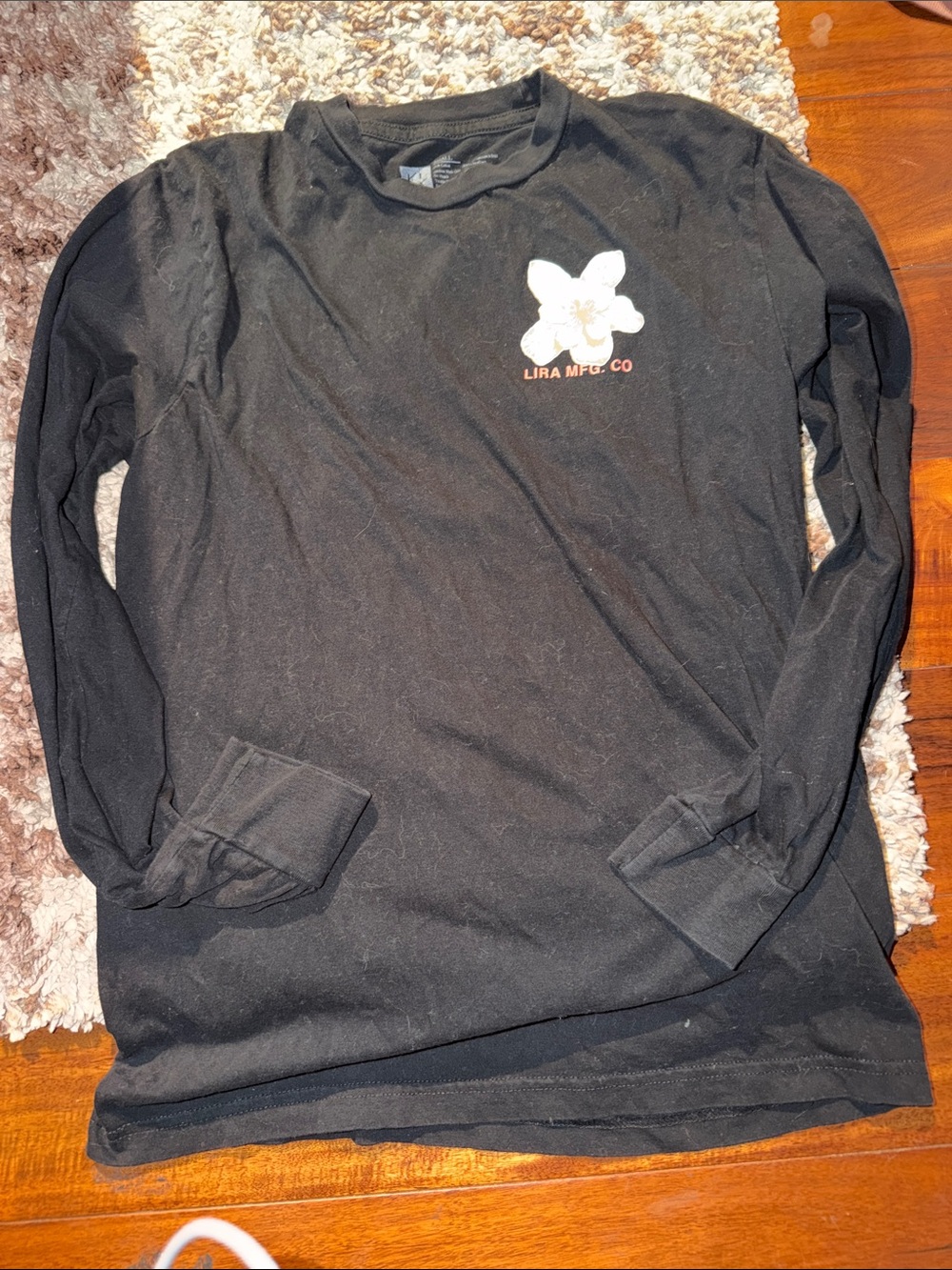 Lira Black Long-Sleeve Jersey with White Floral Logo